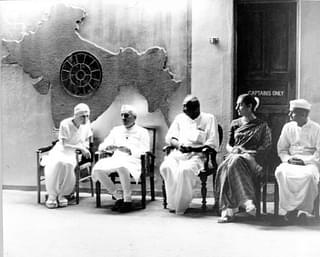 The first prime minister of India Jawaharlal Nehru with future prime ministers, Lal Bahadur Sastri and Indira Gandhi along with the legendary ‘king maker’ K Kamaraj, sitting under the map of undivided India at Sri Aurobindo Ashram.