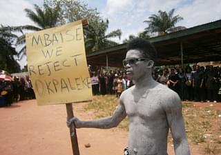 A protester takes part in a rally against the appointment of a priest in the Diocese of Ahiara. (cruxnow.com)