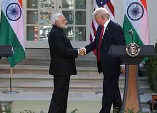 US President Donald Trump and
Indian Prime Minister Narendra Modi shake hands before delivering joint
statements in the Rose Garden of the White House on 26 June in Washington. (Mark
Wilson/GettyImages)