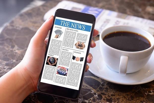 People are obsessed with news. (iStockphoto)