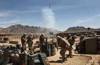 U.S. Marines fire a 120 mm white phosphorous mortar towards a Taliban position on April 3, 2009 in Now Zad in Helmand province, Afghanistan. (Photo by John Moore/Getty Images)
