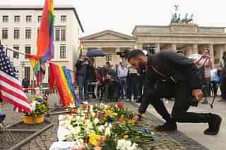A mourner attends a vigil for victims of a shooting at a gay nightclub in Orlando, Florida, in front of the United States embassy in Berlin, Germany. (Adam Berry/Getty Images)