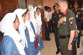 General Bipin Rawat with students from the valley (PIB)