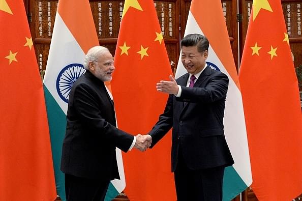 Indian Prime Minister Narendra Modi with Chinese Premier Xi Jinping (Wang Zhou - Pool/Getty Images)