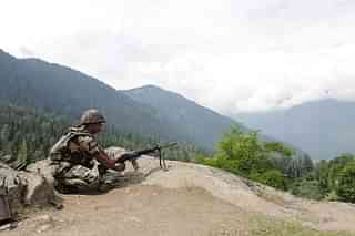A soldier stands guard on a mountain  in Chandanwari, around 116 kilometres south of Srinagar. (Waseem Andrabi/Hindustan Times via GettyImages)