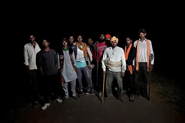 Members of a cow vigilante group pose for a photograph out on a patrol in the hopes of stopping vehicles of cow smugglers in Ramgarh, Rajasthan (2015). (Allison Joyce/Getty Images)