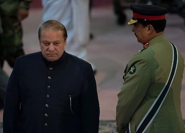 Nawaz Sharif  walks past army chief Raheel Sharif (AAMIR QURESHI/AFP/GettyImages)