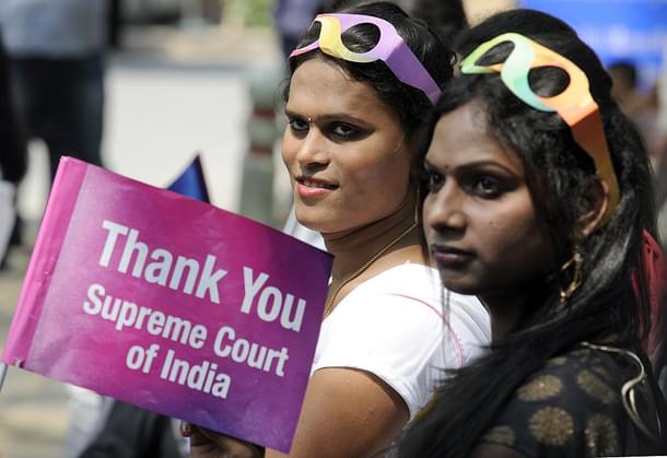 Transgender rights activists hold placards during the one-year celebration of the Supreme Court judgement recognising the transgenders as
‘third gender’ at Jantar Mantar in New Delhi. (Sonu Mehta/Hindustan Times via
GettyImages)
