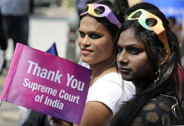 Transgender rights activists hold placards during the one-year celebration of the Supreme Court judgement recognising the transgenders as
‘third gender’ at Jantar Mantar in New Delhi. (Sonu Mehta/Hindustan Times via
GettyImages)