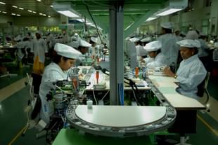 Indian workers at a factory. (Hemant Mishra/Mint via Getty Images) 