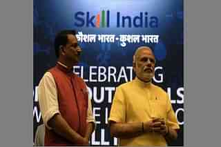 Prime Minister Narendra Modi (R) with Minister of State Skill Development &amp; Entrepreneurship (Independent Charge) Rajiv Pratap Rudy during the launch of the ‘Skill India’ initiative in New Delhi on 15 July 2015. (PRAKASH SINGH/AFP/Getty Images)