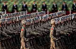 Chinese soldiers march past Tiananmen Square. (Kevin Frayer/GettyImages)