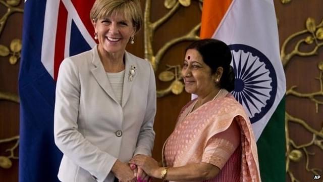 Sushma Swaraj shakes hands with her Australian counterpart Julie Bishop.  

