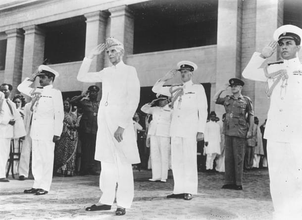 Jinnah taking the salute at a military march past in Karachi, having been sworn in as the first governor general of the Muslim Dominion of Pakistan. (Keystone/GettyImages) 