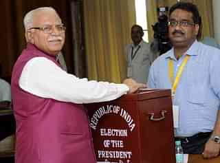 Haryana Chief Minister Manohar Lal Khattar casting his vote for the presidential election. (Keshav Singh/Hindustan Times via Getty Images)