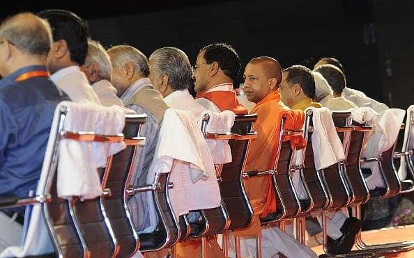 Uttar Pradesh Chief Minister Yogi Adityanath sits amid top ministers and officials at Rashtriya Panchayati Raj Diwas Programme. (Ashok Dutta/Hindustan Times via GettyImages)