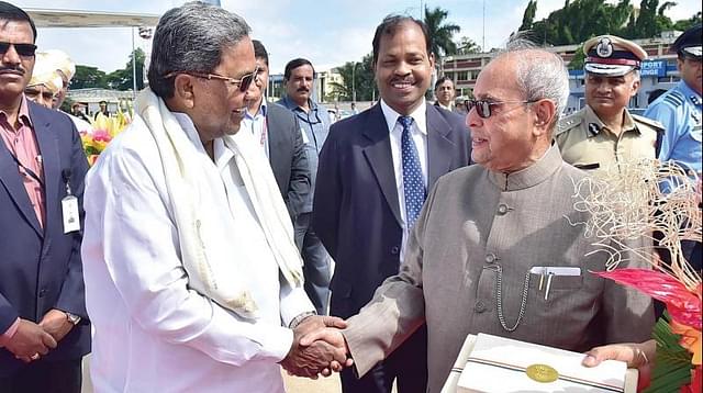 
Chief Minister Siddaramaiah seeing off President Pranab Mukherjee. 

