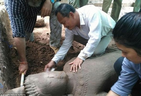 A statue thought to be from the late 12th to the early 13th century has been found at Cambodia’s famed Angkor temple complex. (AFP)