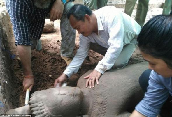 A statue thought to be from the late 12th to the early 13th century has been found at Cambodia’s famed Angkor temple complex. (AFP)