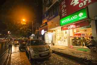 Linking Road shopping hub at night in Mumbai. (Aniruddha Chowhdury/Mint via GettyImages)
