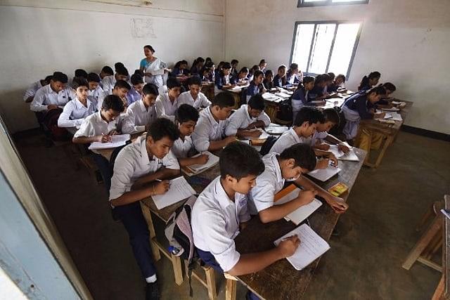 Students sit for an exam