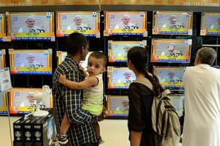 Prime Minister Narendra Modi’s oath-taking on TVs (INDRANIL MUKHERJEE/AFP/Getty Images) 