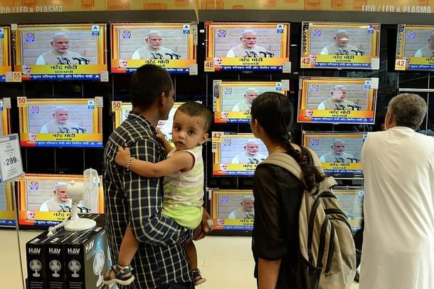 Prime Minister Narendra Modi’s oath-taking on TVs (INDRANIL MUKHERJEE/AFP/Getty Images) 