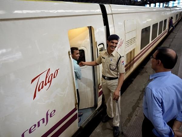 A security personnel stands on guard outside a coach of the Spanish Talgo Train (Arijit Sen/Hindustan Times via Getty Images)