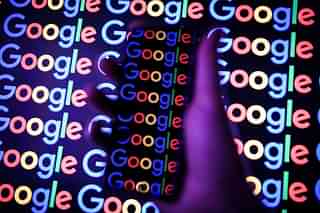 The Google logo is displayed on a mobile phone and computer
monitor. (Leon Neal/GettyImages)