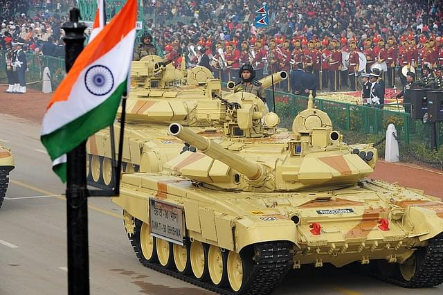 Indian military personnel drive Indian Army tanks as they take part in the Republic Day parade in New Delhi on January 26, 2014. (RAVEENDRAN/AFP/Getty Images)