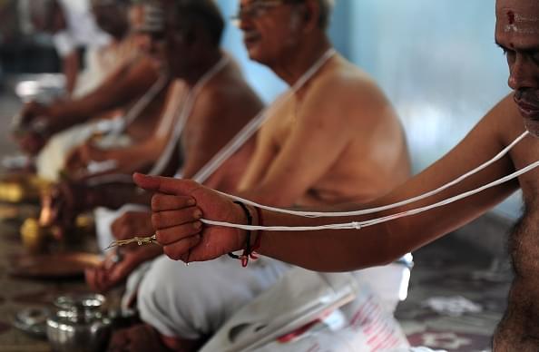 Brahmin community members perform a ritual on the occasion of ‘Aavani Avittam’ in Chennai. (ARUN SANKAR/AFP/GettyImages)