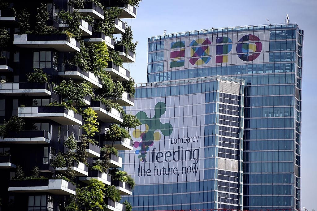 A picture shows the Lombardia Region building advertizing EXPO2015 (R) and a part of the Bosco Verticale towers (Vertical Forest) in the Porta Nuova area on April 28, 2015. (OLIVIER MORIN/AFP/Getty Images)