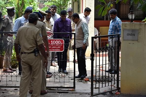 Special Investigation Team  investigates the spot where senior journalist Gauri Lankesh was killed. (Arijit Sen/Hindustan Times via Getty Images)