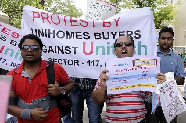 Home buyers of Noida, Greater Noida and Greater Noida west (Noida Extension) participated in a protest organised by Noida Estate Flat Owner Main Association (NEFOMA) at City Magistrate office Sector 19, on June 22, 2014 in Noida, India. Buyers handed over memorandum to City Magistrate for Prime Minister of India to bring attention on the issues of buyers who are waiting for their dream homes and facing many problems. (Burhaan Kinu/Hindustan Times via Getty Images)