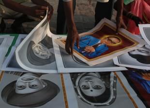 Photos of Ambedkar are being sold to people arriving to pay homage to Dr B R Ambedkar on his death anniversary on 6 December -
(Anshuman Poyrekar/Hindustan Times via Getty Images) 