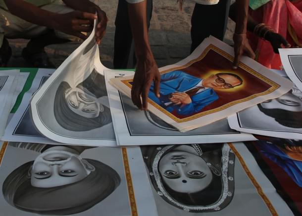 Photos of Ambedkar are being sold to people arriving to pay homage to Dr B R Ambedkar on his death anniversary on 6 December -
(Anshuman Poyrekar/Hindustan Times via Getty Images) 
