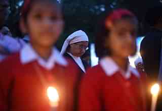 Students at a minority-run institution take part in a vigil in New Delhi. (SAJJAD HUSSAIN/AFP/GettyImages)
