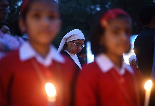 Students at a minority-run institution take part in a vigil in New Delhi. (SAJJAD HUSSAIN/AFP/GettyImages)