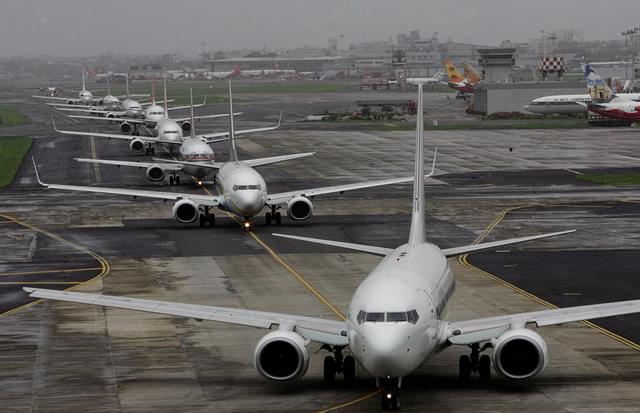 Planes lined up for take-off at Mumbai Airport (Vijayananda Gupta/Hindustan Times via Getty Images)