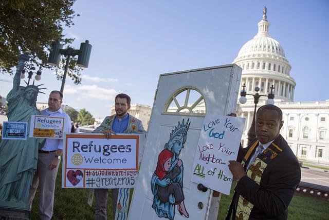 

Protestors campaigning to let refugees enter the United States (ANDREW CABALLERO-REYNOLDS/AFP/Getty Images)