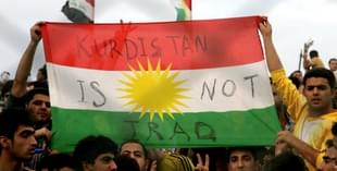 Iraqi Kurdish football 
fans holding a Kurdistan flag. SAFIN HAMED/AFP/Getty Images)