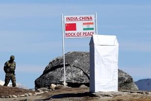An Indian Army soldier keeps a vigil at Bumla pass at the India-China border. (BIJU BORO/AFP/Getty Images)