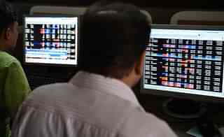 Indian stock traders watch share prices on their terminals. (INDRANIL MUKHERJEE/AFP/Getty Images)