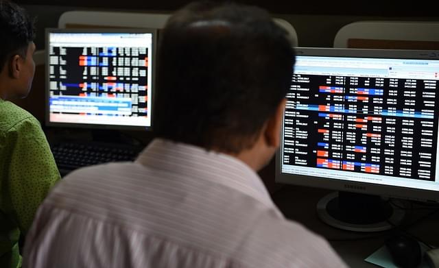 Indian stock traders watch share prices on their terminals at a brokerage house in Mumbai on July 25, 2017. (INDRANIL MUKHERJEE/AFP/Getty Images)