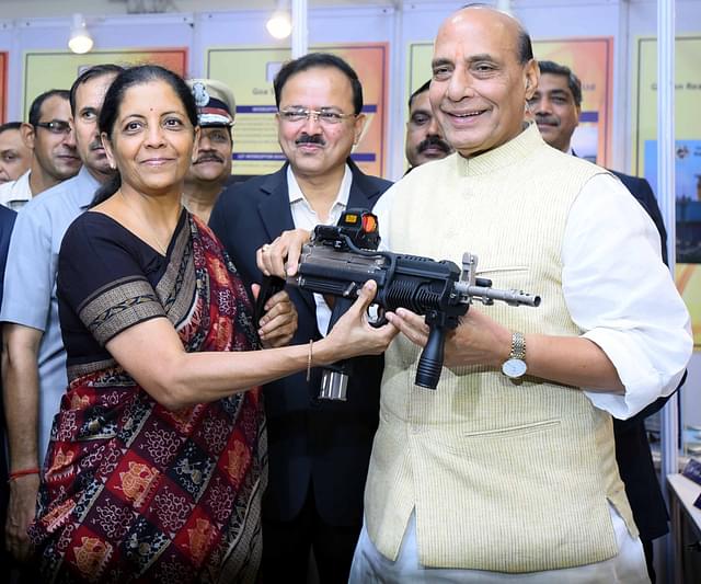 Defence Minister Nirmala Sitharaman and Home Minister Rajnath Singh having a feel of carbine indigenously produced by Ordnance Factory handed over to paramilitary forces for user trials at the DRDO Bhawan in New Delhi, India. (Arun Sharma/Hindustan Times via GettyImages)