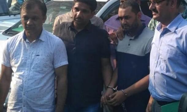 Suspected al Qaeda operative with Delhi Police Special Cell officials. (ANI)