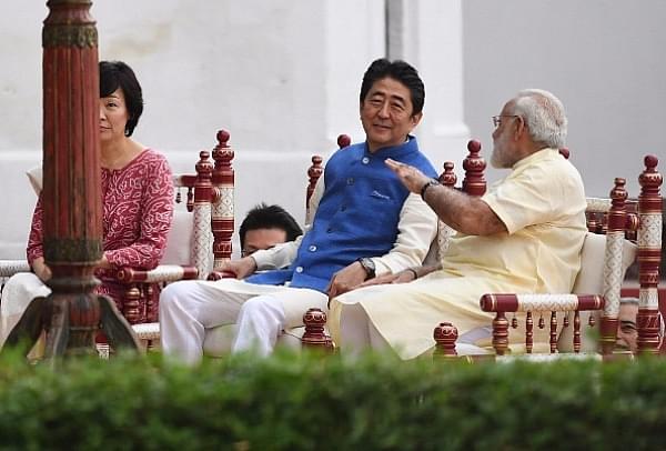 Prime Minister Narendra Modi (R) with Japanese Prime Minister Shinzo Abe (C) and his wife Akie Abe (L) during their visit to Sabarmati Ashram in Ahmedabad. (PRAKASH SINGH/AFP/Getty Images)