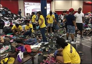 Volunteers sorting relief material