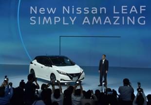 Nissan’s chief executive Hiroto Saikawa
stands next to the new Nissan LEAF. (Kazuhiro Nogi/AFP/Getty Images