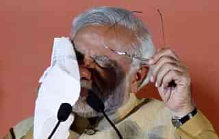 Narendra Modi wipes the sweat from his face during an election rally at MMRDA ground, BKC on April 21, 2014 in Mumbai, India. (Kunal Patil/Hindustan Times via Getty Images)